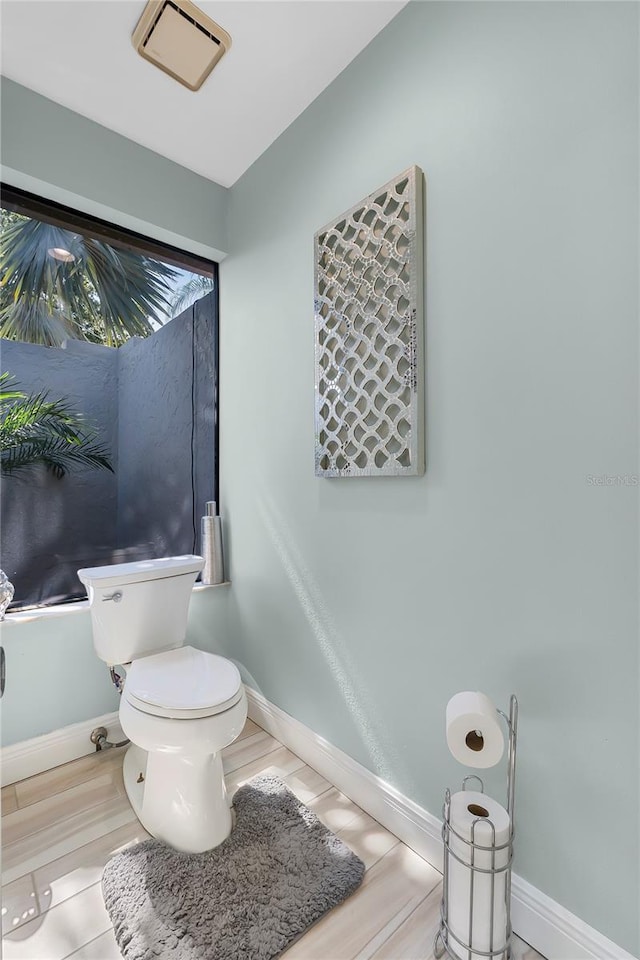 7313 Crape Myrtle Way, Sarasota, FL 34241 - bathroom with toilet and baseboards