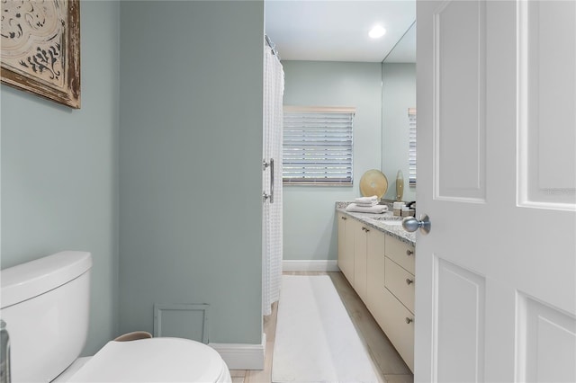 7313 Crape Myrtle Way, Sarasota, FL 34241 - full bathroom featuring toilet, baseboards, vanity, and recessed lighting