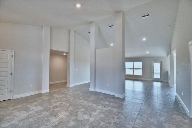 tiled empty room featuring high vaulted ceiling, recessed lighting, and baseboards