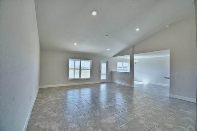 empty room with recessed lighting, vaulted ceiling, baseboards, light tile patterned flooring, and a chandelier