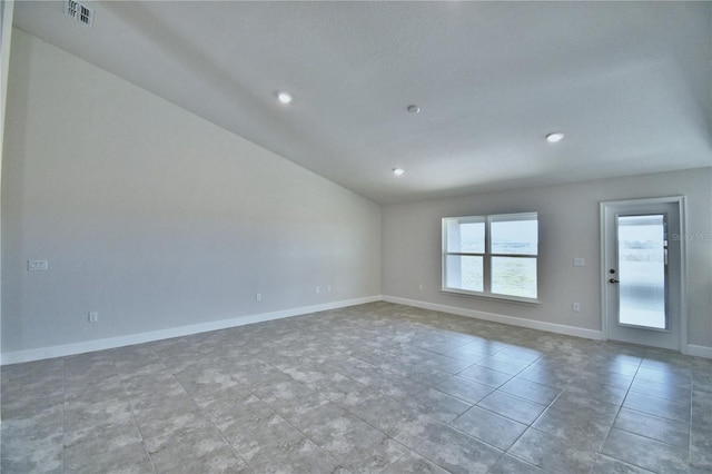 unfurnished room featuring lofted ceiling, recessed lighting, baseboards, and tile patterned flooring