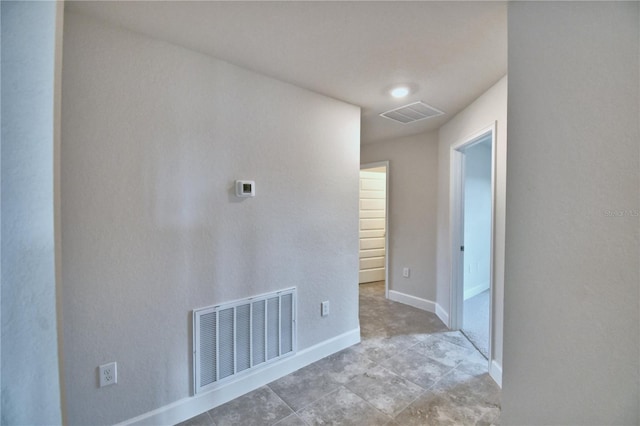 tiled empty room with baseboards