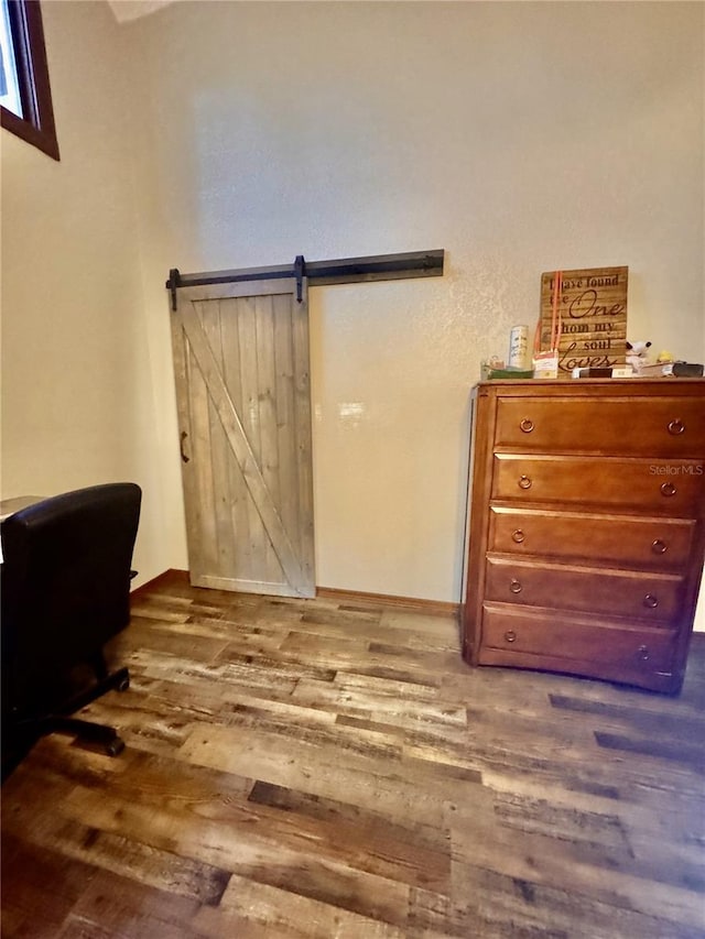 5619 Antler Trl, Lakeland, FL 33811 - interior space with a barn door and dark wood-style floors