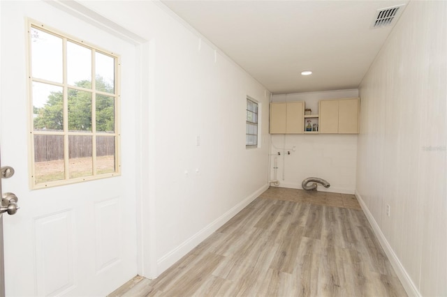 4008 S Carlisle Rd, Lakeland, FL 33813 - laundry area with cabinet space, light wood finished floors, and recessed lighting