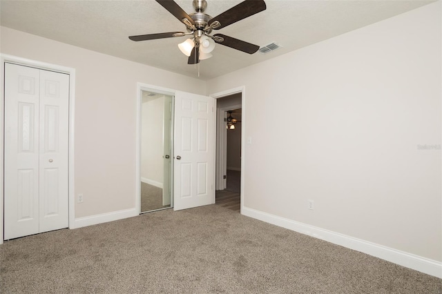 4008 S Carlisle Rd, Lakeland, FL 33813 - unfurnished bedroom featuring carpet flooring, a ceiling fan, and a closet