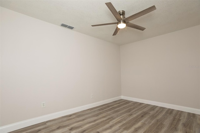 4008 S Carlisle Rd, Lakeland, FL 33813 - empty room with wood finished floors and ceiling fan