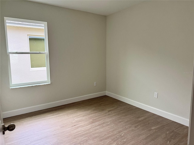 625 W 9th St, Lakeland, FL 33805 - unfurnished room featuring wood finished floors and baseboards