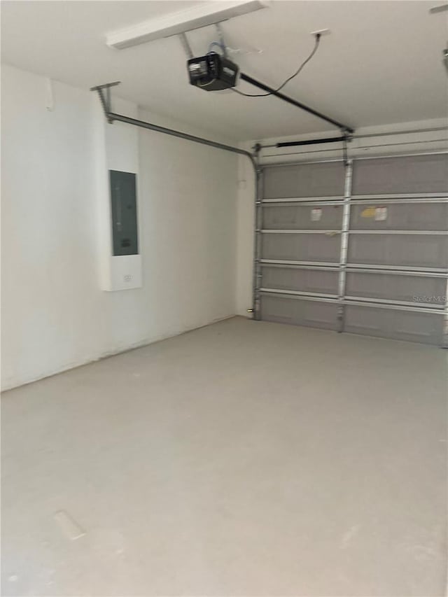 625 W 9th St, Lakeland, FL 33805 - garage with electric panel and a garage door opener