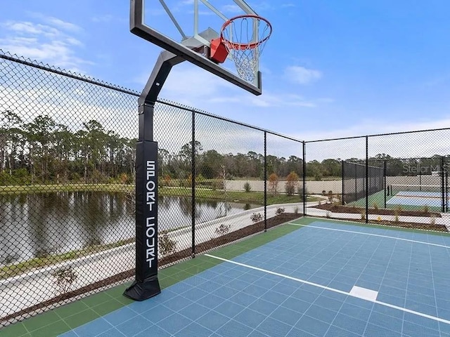 5418 Duxford Cir, Saint Cloud, FL 34771 - view of basketball court featuring a water view, fence, and community basketball court