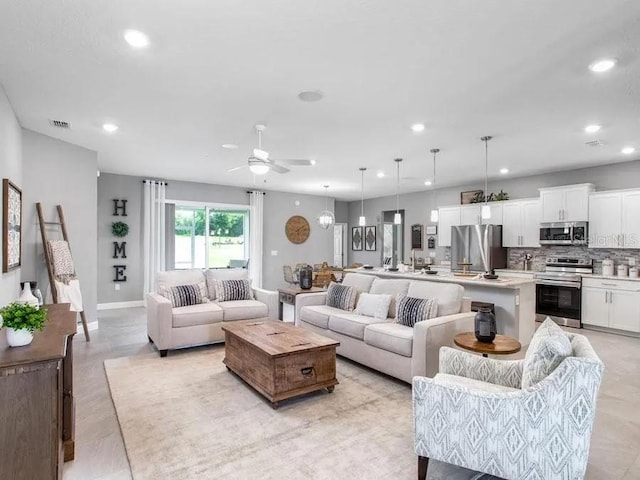 5418 Duxford Cir, Saint Cloud, FL 34771 - living area with visible vents, baseboards, ceiling fan, and recessed lighting