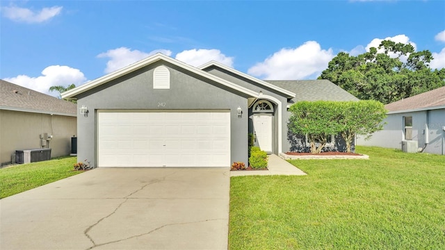 242 Kings Pond Ave SW, Winter Haven, FL 33880 - ranch-style house with an attached garage, driveway, a front lawn, and cooling unit
