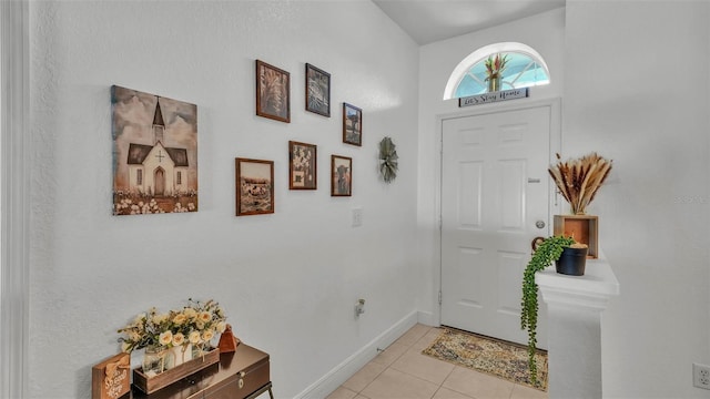 242 Kings Pond Ave SW, Winter Haven, FL 33880 - foyer featuring light tile patterned flooring and baseboards