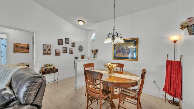 242 Kings Pond Ave SW, Winter Haven, FL 33880 - dining area with light tile patterned floors, a chandelier, baseboards, and vaulted ceiling