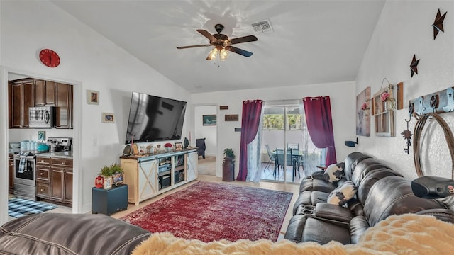 242 Kings Pond Ave SW, Winter Haven, FL 33880 - living area featuring lofted ceiling, ceiling fan, and light tile patterned flooring