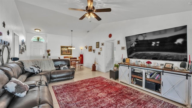 242 Kings Pond Ave SW, Winter Haven, FL 33880 - living room with vaulted ceiling, a ceiling fan, and light tile patterned floors