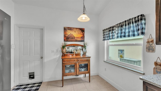 242 Kings Pond Ave SW, Winter Haven, FL 33880 - dining room with baseboards and light tile patterned floors