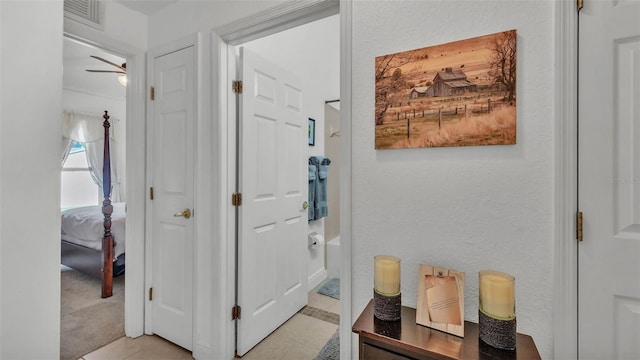 242 Kings Pond Ave SW, Winter Haven, FL 33880 - hall with light tile patterned floors