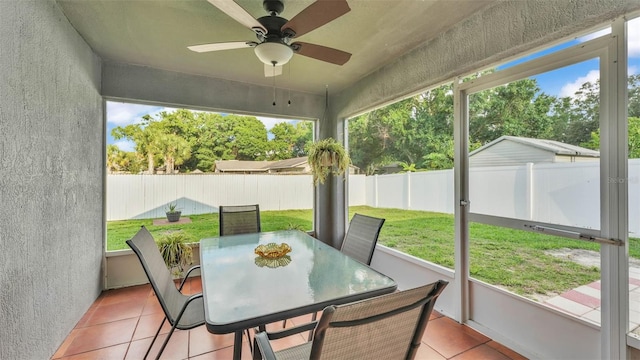 242 Kings Pond Ave SW, Winter Haven, FL 33880 - sunroom with a ceiling fan, healthy amount of natural light, and outdoor dining space