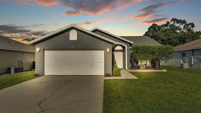 242 Kings Pond Ave SW, Winter Haven, FL 33880 - single story home with an attached garage, concrete driveway, a front lawn, and stucco siding