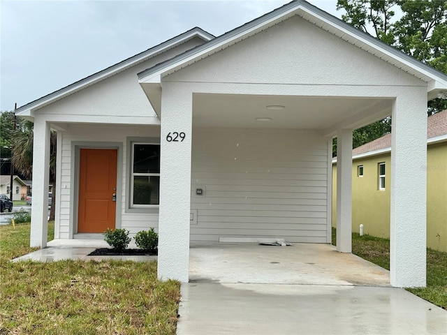 629 W 9th, Lakeland, FL 33805 - view of front of home featuring a carport and a front yard