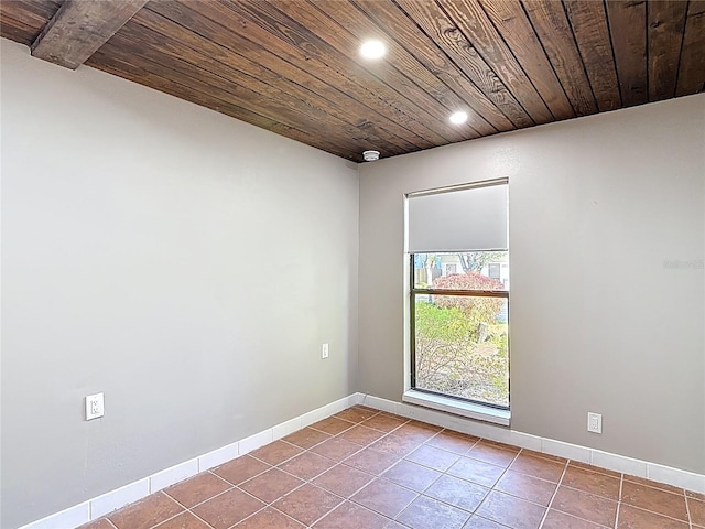 tiled spare room with baseboards, recessed lighting, and wood ceiling