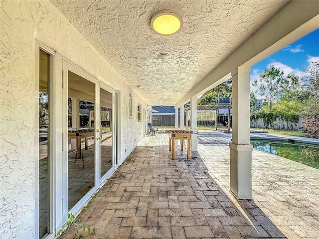 view of patio / terrace featuring fence and a fenced in pool