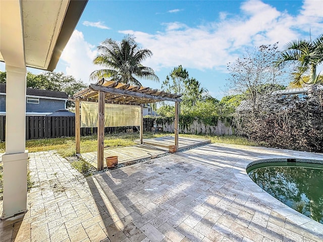 view of patio with a pergola, a fenced backyard, and a swimming pool