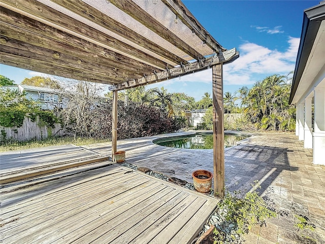 view of dock with a fenced backyard, a patio, and a fenced in pool