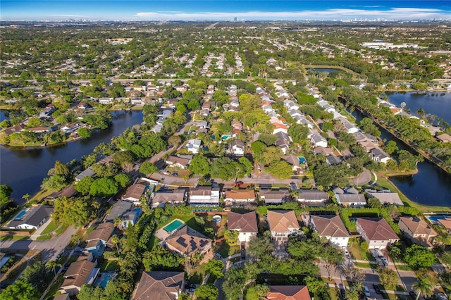 bird's eye view featuring a water view and a residential view