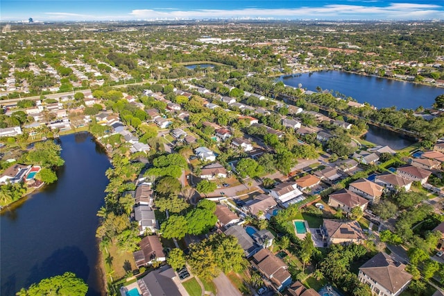 bird's eye view featuring a water view and a residential view
