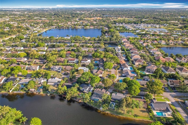 drone / aerial view with a water view and a residential view