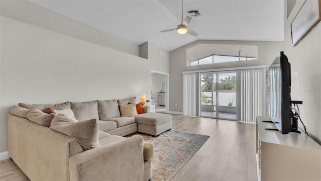 living room with high vaulted ceiling, a ceiling fan, and baseboards