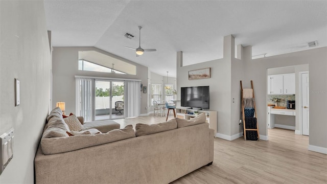 living room featuring a ceiling fan, light wood finished floors, high vaulted ceiling, and baseboards