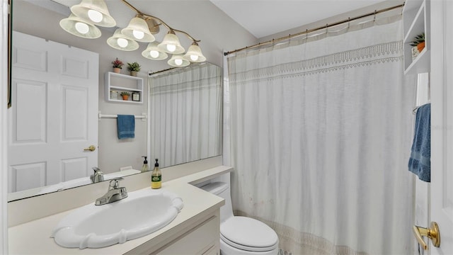 bathroom with toilet and vanity