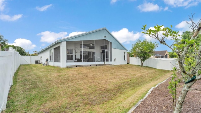 rear view of property with a sunroom and central AC unit