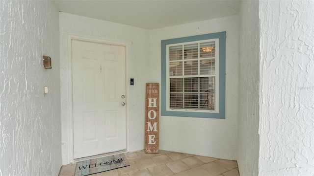 doorway to property with stucco siding