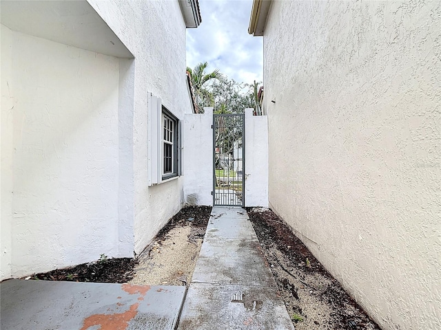 10764 Lenox Rd, Hollywood, FL 33026 - entrance to property featuring a gate and stucco siding