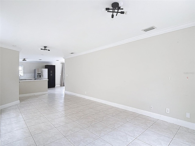 10764 Lenox Rd, Hollywood, FL 33026 - spare room featuring crown molding, light tile patterned flooring, and baseboards