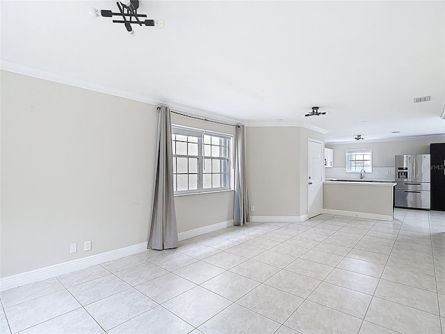 10764 Lenox Rd, Hollywood, FL 33026 - unfurnished living room with crown molding, light tile patterned floors, baseboards, and a sink