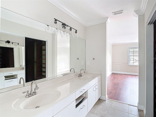 10764 Lenox Rd, Hollywood, FL 33026 - bathroom featuring ornamental molding, double vanity, and baseboards