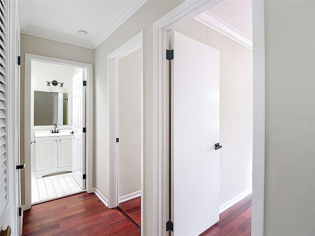 10764 Lenox Rd, Hollywood, FL 33026 - corridor with crown molding, dark wood finished floors, a sink, and baseboards