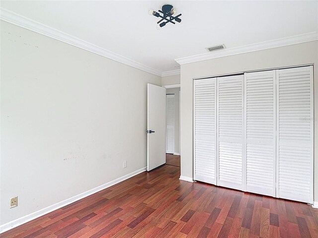 10764 Lenox Rd, Hollywood, FL 33026 - unfurnished bedroom featuring wood finished floors, crown molding, baseboards, and a closet