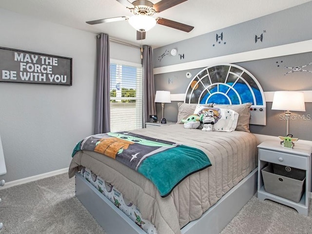 carpeted bedroom featuring baseboards and ceiling fan