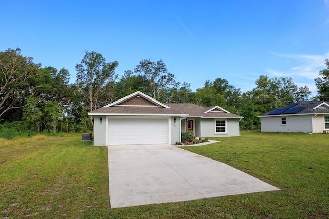 single story home featuring an attached garage, driveway, a front yard, and stucco siding
