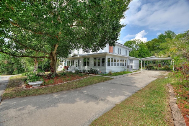 716 S Franklin Pl, Lakeland, FL 33815 - farmhouse-style home with a carport and driveway