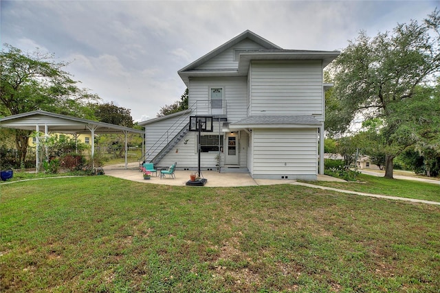 716 S Franklin Pl, Lakeland, FL 33815 - rear view of property with a lawn and a patio