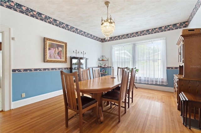 716 S Franklin Pl, Lakeland, FL 33815 - dining room with baseboards, a chandelier, and light wood-style flooring