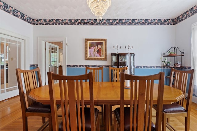 716 S Franklin Pl, Lakeland, FL 33815 - dining area with a chandelier and wood finished floors