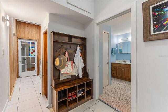 716 S Franklin Pl, Lakeland, FL 33815 - mudroom with a sink, light tile patterned floors, and wooden walls