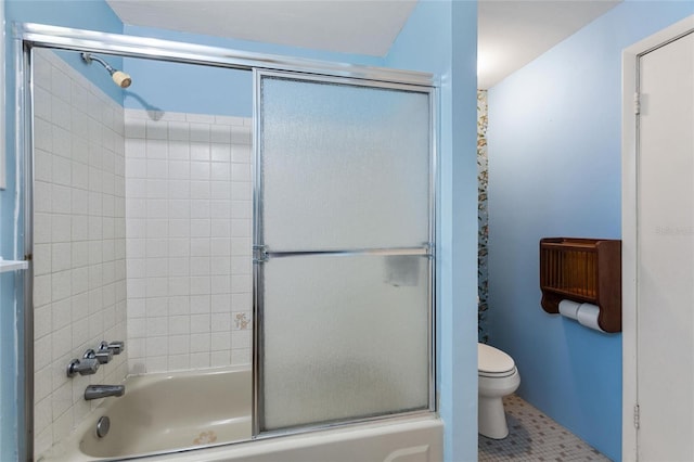 716 S Franklin Pl, Lakeland, FL 33815 - full bathroom with toilet, bath / shower combo with glass door, and tile patterned flooring